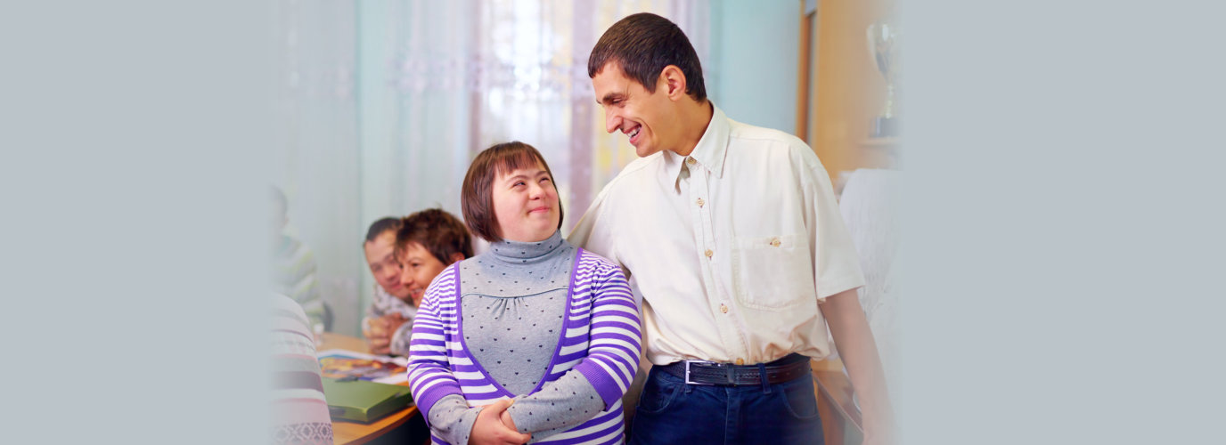 happy people with disability in rehabilitation center